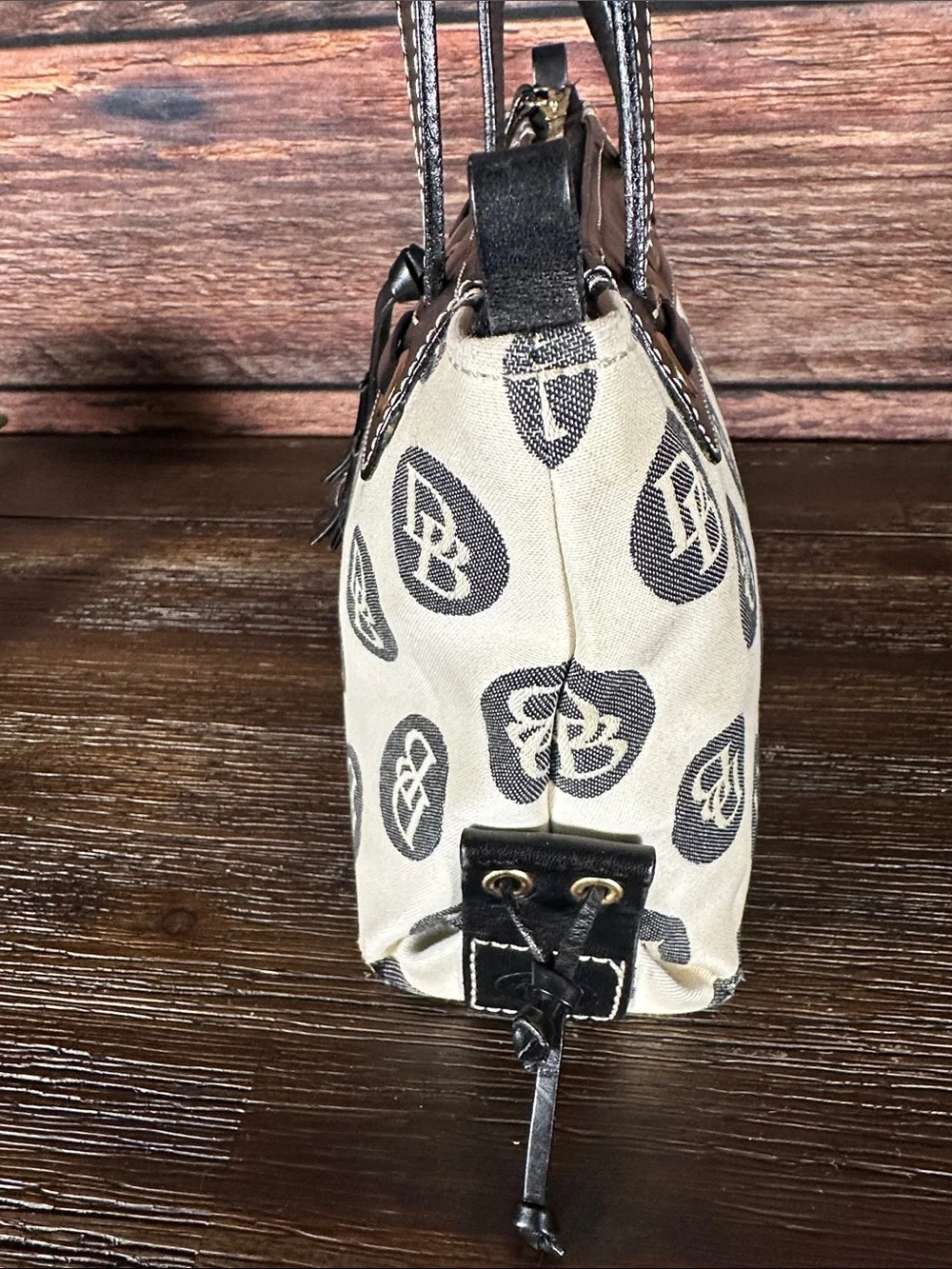 Dooney & Bourke Vintage logo jacquard handbag in cream and black.